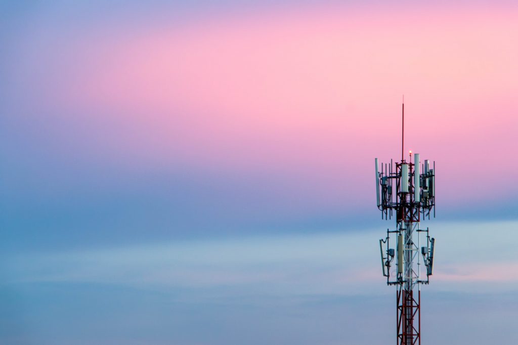 Cellular Signal Tower The background is sky in the evening, blue and pink.